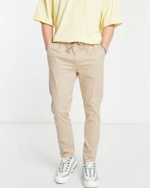 ASOS DESIGN skinny chinos with elasticated waist in beige-Neutral