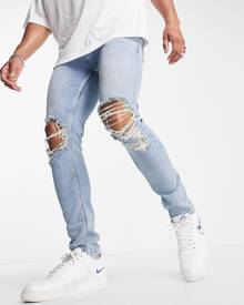 ASOS DESIGN skinny jeans in mid wash blue with knee rips