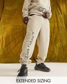 ASOS DESIGN ASOS Dark Future relaxed trackies in teddy borg with leg logo embroidery in neutral (part of a set)