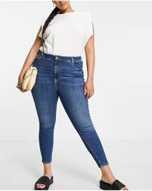 River Island Plus high rise sculpt skinny jeans in dark blue