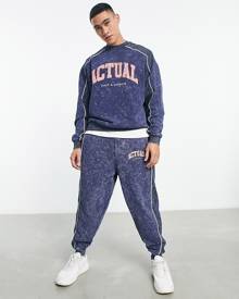 ASOS DESIGN ASOS Actual relaxed trackies with piping and front print logo in washed blue