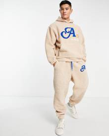 ASOS DESIGN ASOS Actual relaxed trackies in teddy borg with boucle logo in cream (part of a set)-Neutral