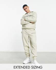 ASOS DESIGN ASOS Dark Future relaxed trackies in polar fleece with logo applique in stone (part of a set)-Neutral