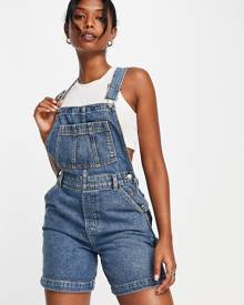 ASOS DESIGN Petite 'original' denim dungarees in midwash