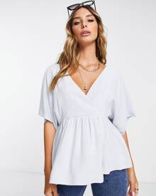 ASOS DESIGN wrap top with angel sleeve & peplum hem in icy blue