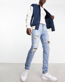 ASOS DESIGN skinny jeans with rips in light wash blue