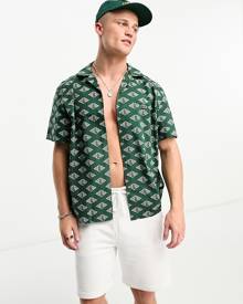 Lacoste relaxed fit short sleeve shirt in dark green with all over print