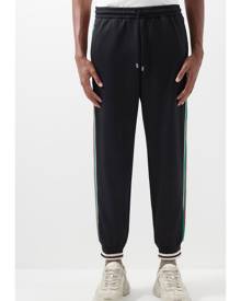 GUCCI Webbing-Trimmed Monogrammed Jersey Sweatpants for Men