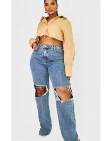 PrettyLittleThing Plus Vintage Wash Ripped Knee Split Hem Jeans