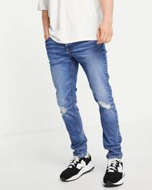 ASOS DESIGN skinny jeans in dark wash blue with knee rips-Blues