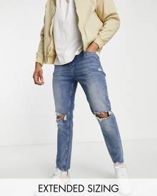 ASOS DESIGN skinny jeans in mid blue with knee rips and raw hem detail