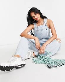 Dr Denim overalls with ripped knees in light blue wash