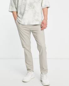 ASOS DESIGN skinny chinos with elasticated waist in beige-Neutral