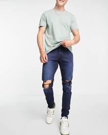 Jack & Jones Intelligence Pete skinny carrot jeans with knee rips in blue black wash