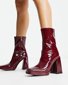 RAID Vista heeled sock boots in dark red vinyl