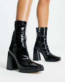RAID Vista heeled sock boots in black vinyl