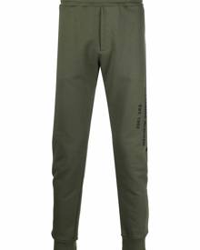 Alexander McQueen logo print tapered track trousers - Green