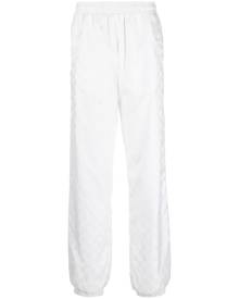 MISBHV monogram-print elasticated-waist track pants - White