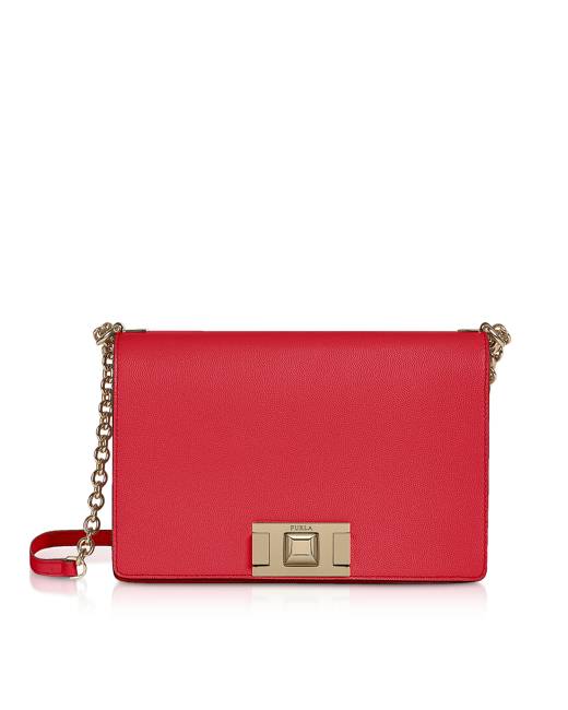 Furla Viva Mini Pochette crafted in Suede with crystal floral  embellishments plays on the timelessness of the chain bag with a sliding  strap that goes from shoulder to crossbody. Featuring flap top