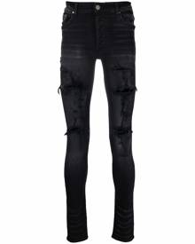 AMIRI distressed skinny jeans