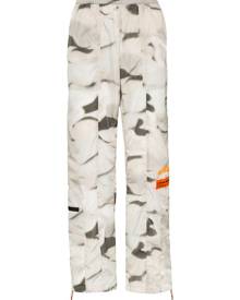 Heron Preston - camouflage print track pants - men - Polyamide - L - ORANGE