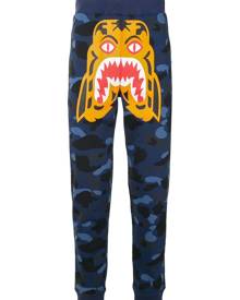 A BATHING APE® - Camouflage Tiger track pants - men - Cotton - L - Blue