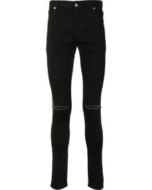 Balmain - ripped-knee skinny jeans - men - Cotton/Polyimide - 29, 31 - Black