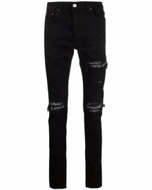 AMIRI ripped-detailing skinny jeans