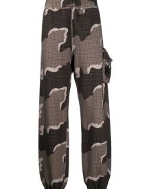 Undercover x Eastpak camouflage-print track pants