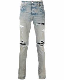 AMIRI distressed-finish ripped skinny jeans - Blue