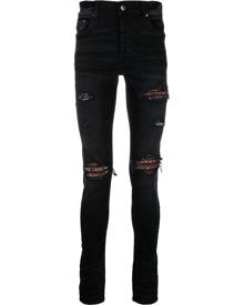 AMIRI distressed skinny jeans - Black