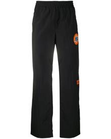 Heron Preston logo-print trousers - Black