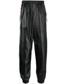 Moschino cropped leather track pants - Black